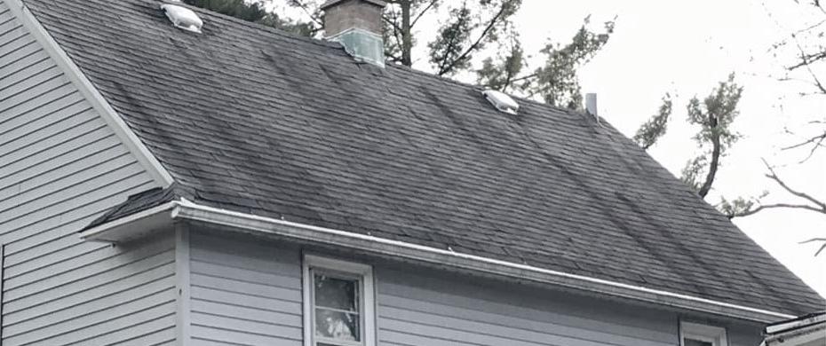 dirty black streaks on roof shingles